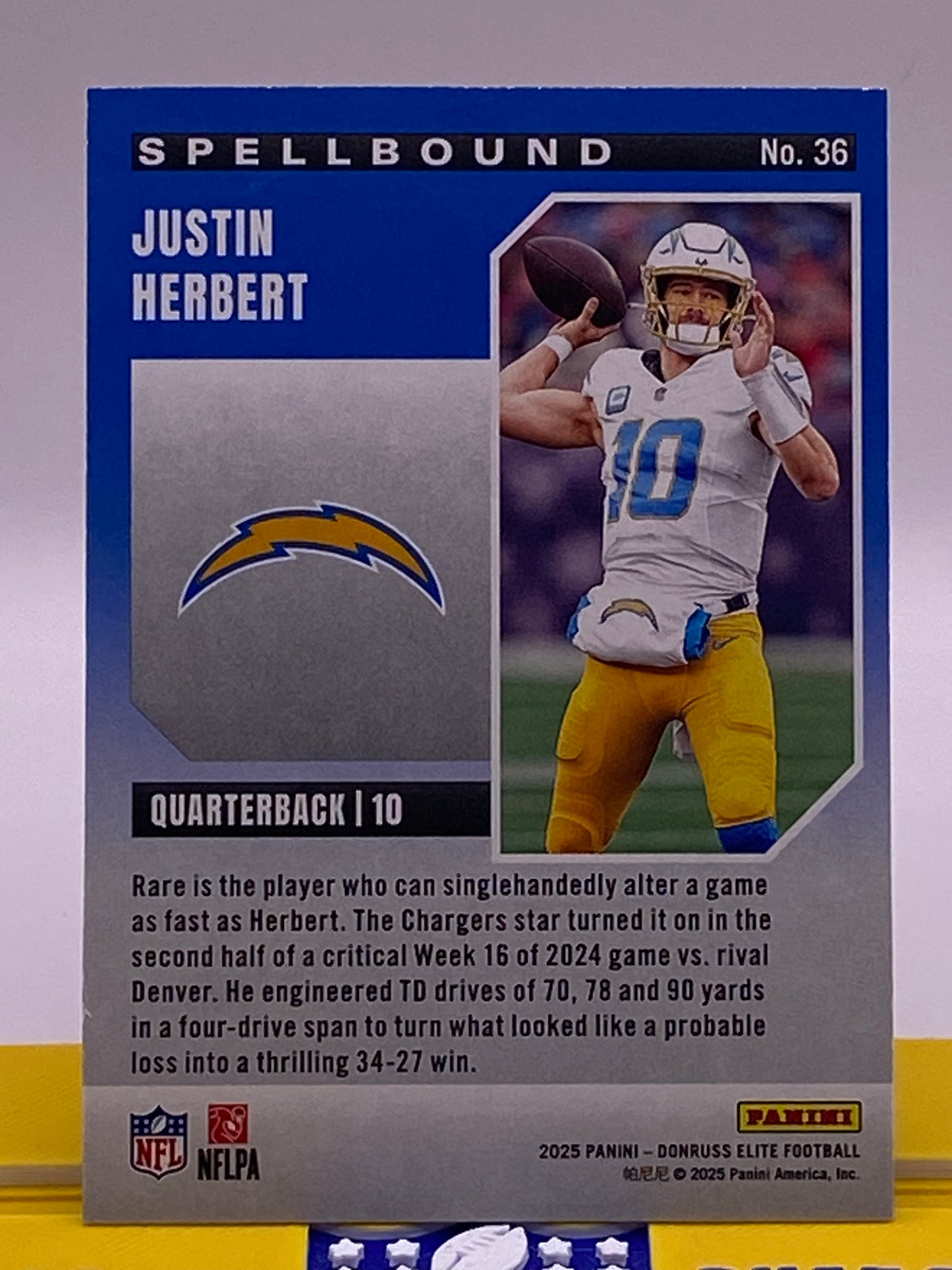 2025 Panini Donruss Elite Spellbound Justin Herbert “R” /799 (394/799) – LA Chargers #36