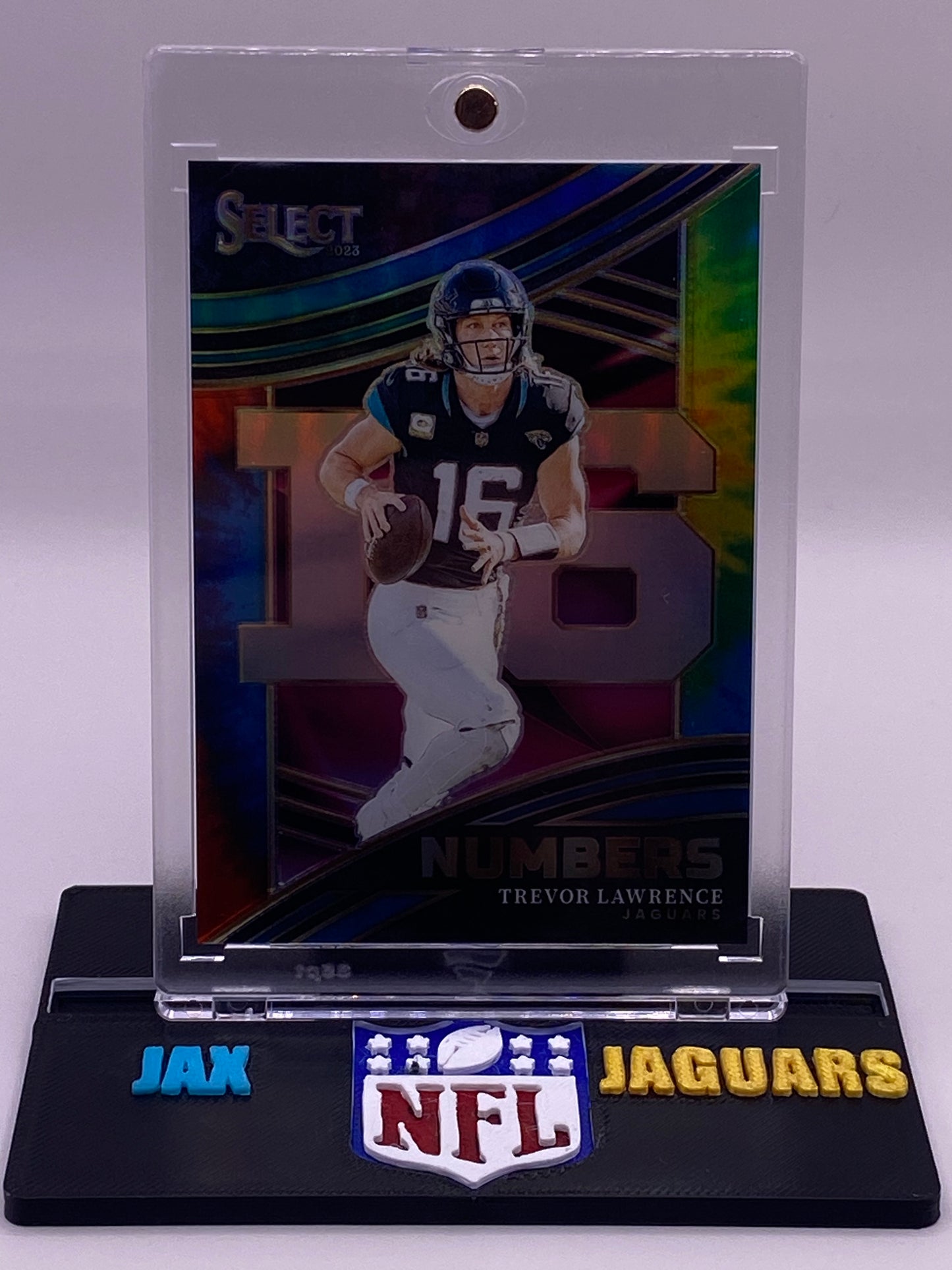 2023 Panini Select Trevor Lawrence Numbers Prizm SSP /25 (15/25) Jaguars Insert – NMB-TLA