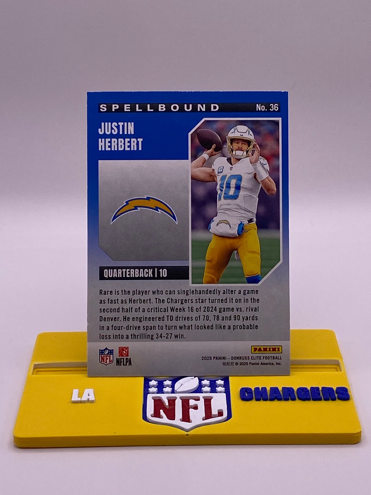 2025 Panini Donruss Elite Spellbound Justin Herbert “R” /799 (394/799) – LA Chargers #36